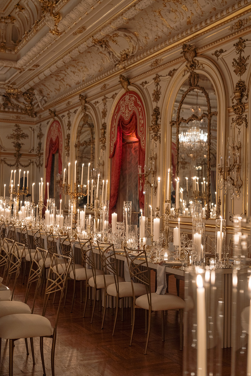 Wide linear ballroom seating layout using gold Chameleon chairs and ivory cushions.